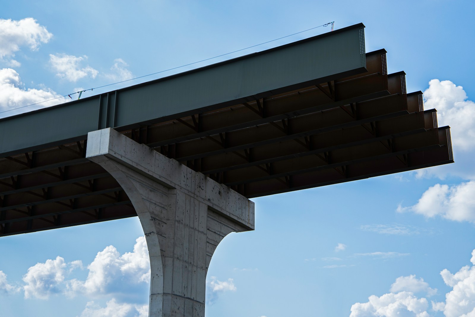 A view of the top of a building under a blue sky